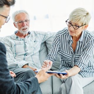 Retired couple meeting with financial advisor