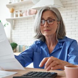 Woman looking over financial statement